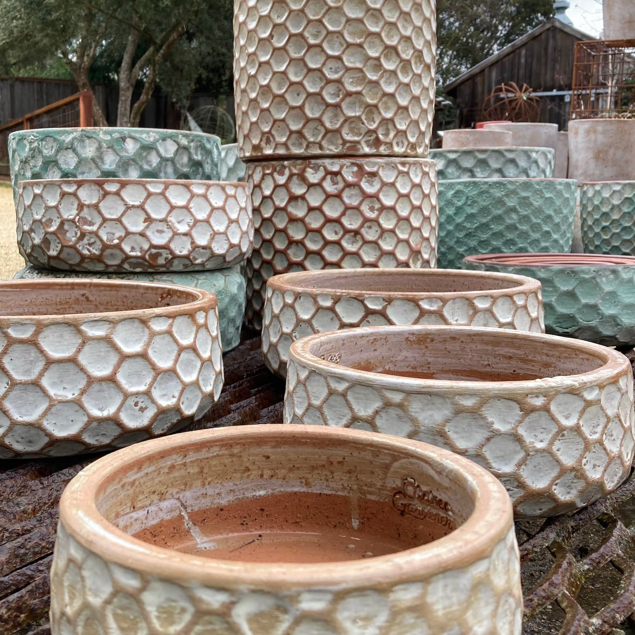 Stacked ceramic pots with a honeycomb pattern